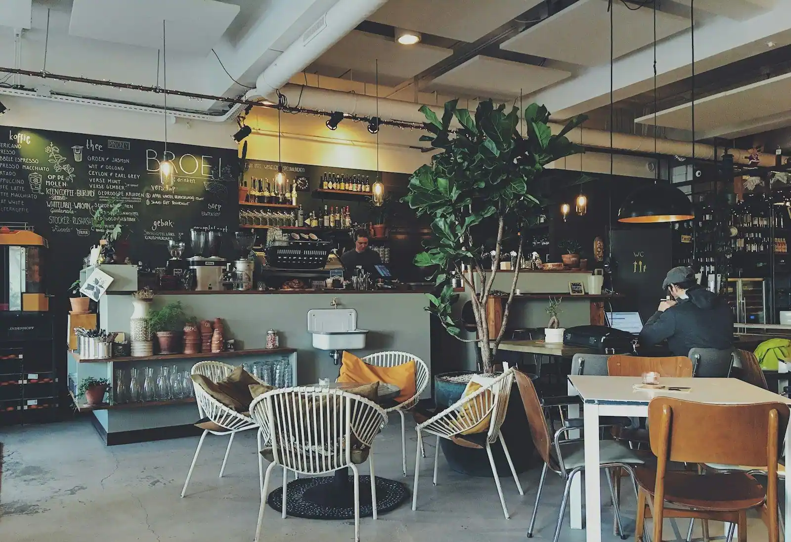 Inside the café, with the coffee bar and a few tables to sit in.