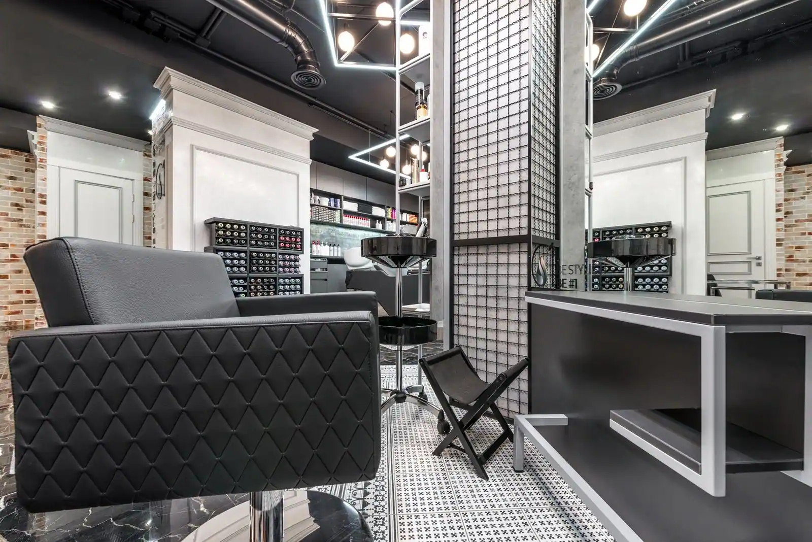 Contemporary, sophisticated salon interior with stylish furniture and lighting